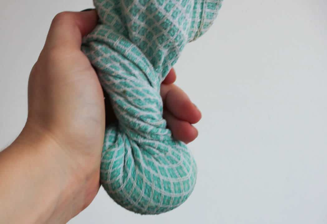 Wringing out the moisture from cauliflower rice.