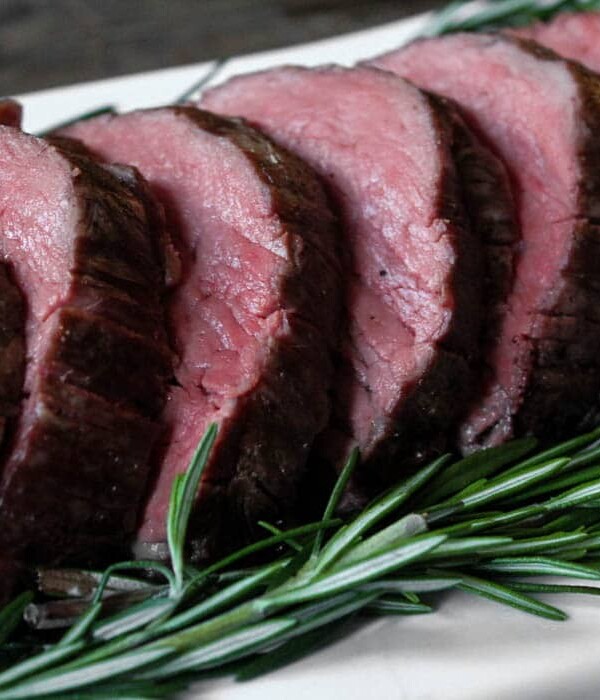 Close up of medium-rare sliced beef tenderloin