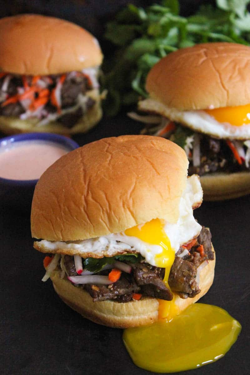 korean-steak-bulgogi-sandwiches-with-slaw-creamy-spicy-sauce-fried-eggs-6
