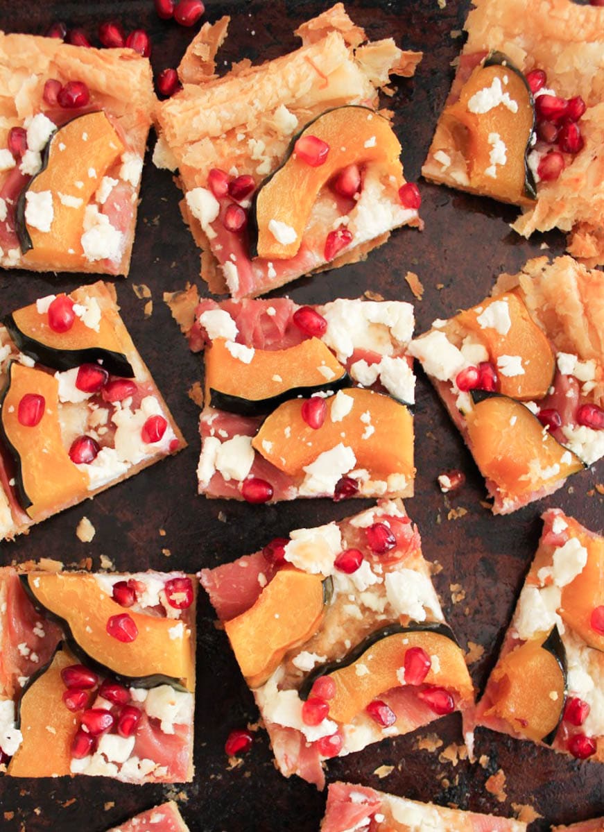 Acorn Squash Tart with Prosciutto and Pomegranate sliced into squares