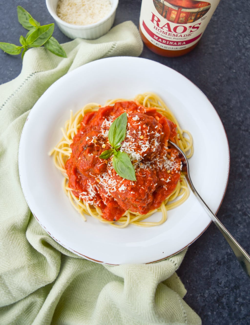 Single bowl of spaghetti with meatballs and Rao's Homemade marinara sauce.